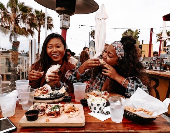 Two friends enjoying a meal